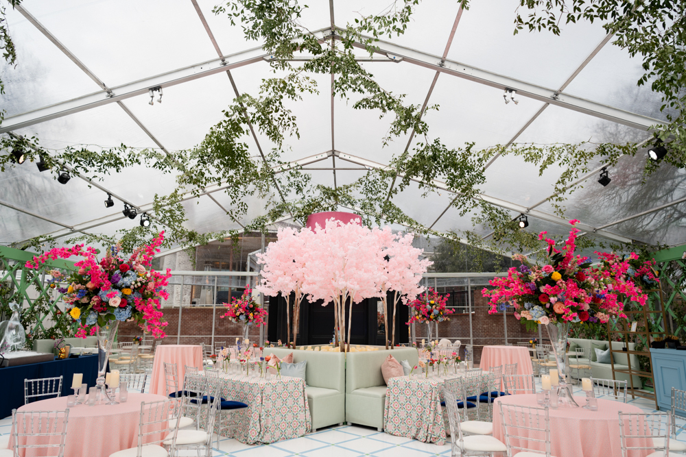 Lush florals, soft pinks and blues, and elegant green latticework transformed this private backyard into a garden-inspired celebration space—every detail thoughtfully designed for beauty and impact. Photographed by Jennifer & Tracy for Lightly Photography