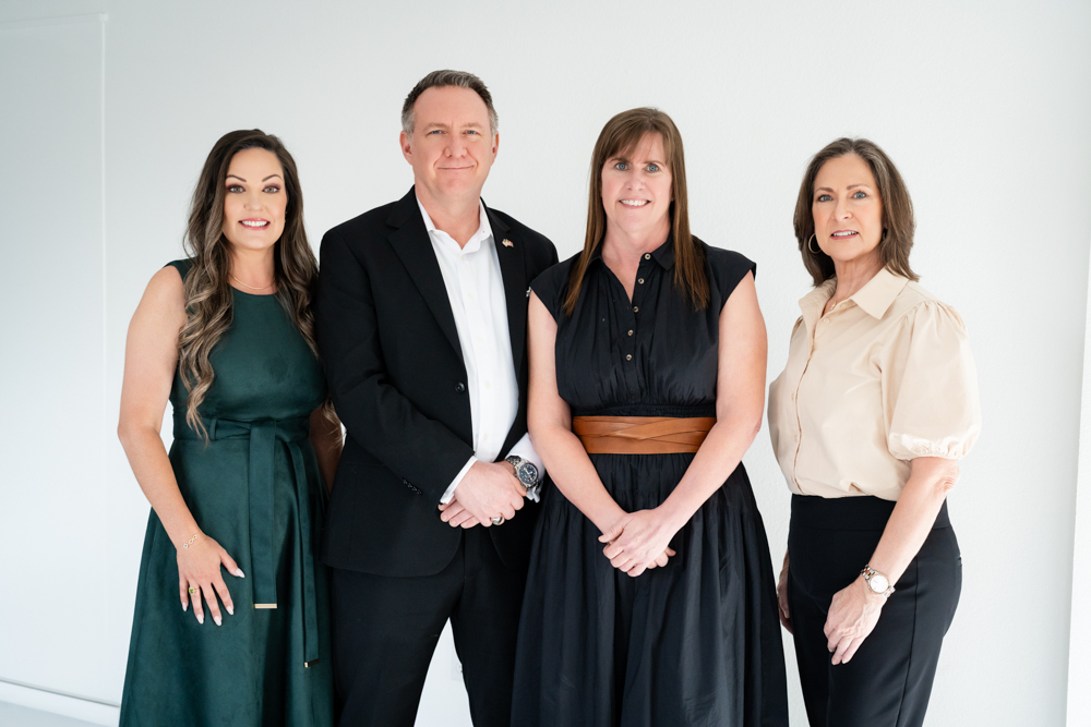 Confident studio headshot for a Tarrant County Realtor