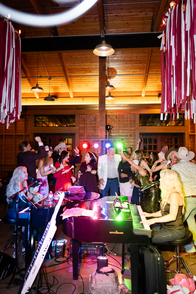 Guests dancing at Bruce's Aggie-themed 70th birthday at Whiskey Ranch